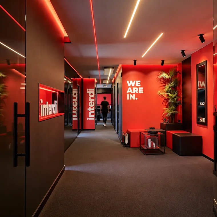 Red-lit hallway with İnterdi signage